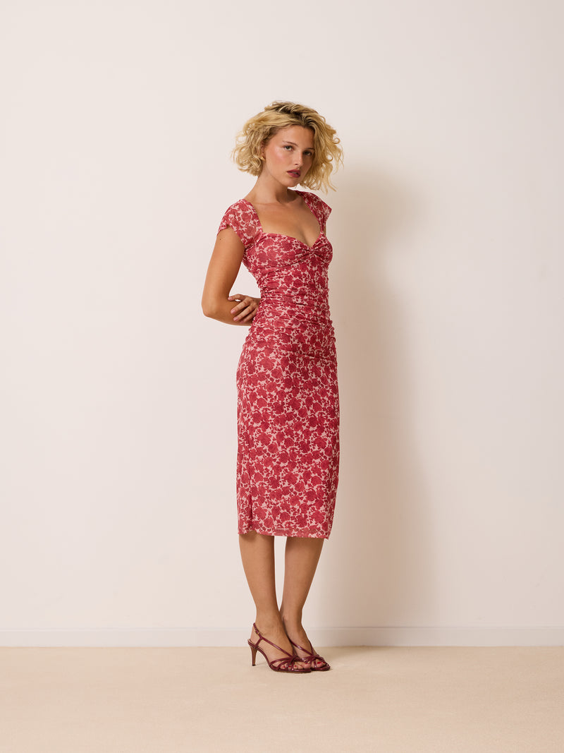 LALY raspberry floral midi mesh dress worn on a model by Rouje
