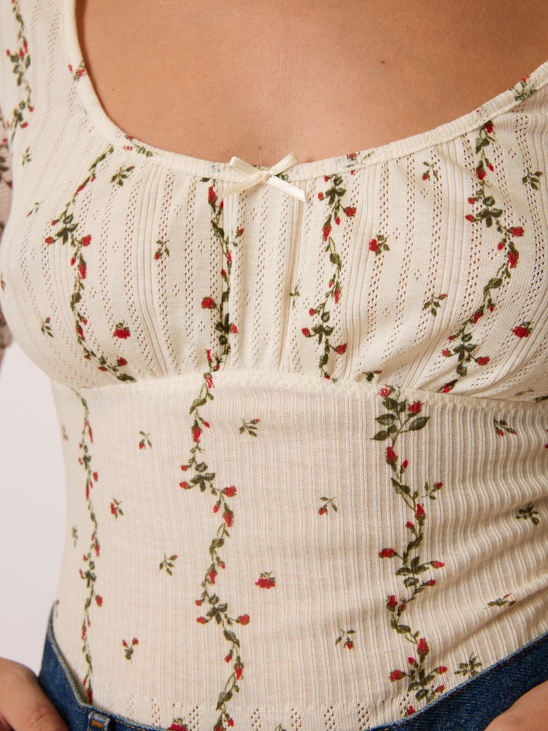 MELENA ecru Lucia floral print bodysuit, detail of openwork band at chest by Rouje