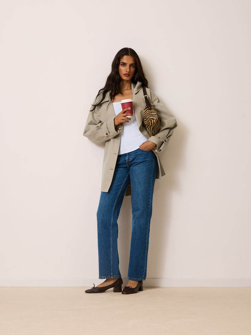 THEODORA putty beige trench coat, lifestyle setting by Rouje