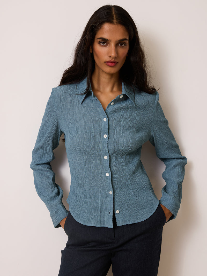 PALMYRA denim blue crinkle shirt worn on a model by Rouje