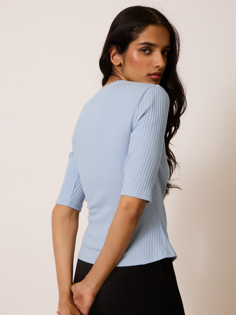 SIDONIE misty blue wrap-effect top, detail of lace trim V-neck by Rouje
