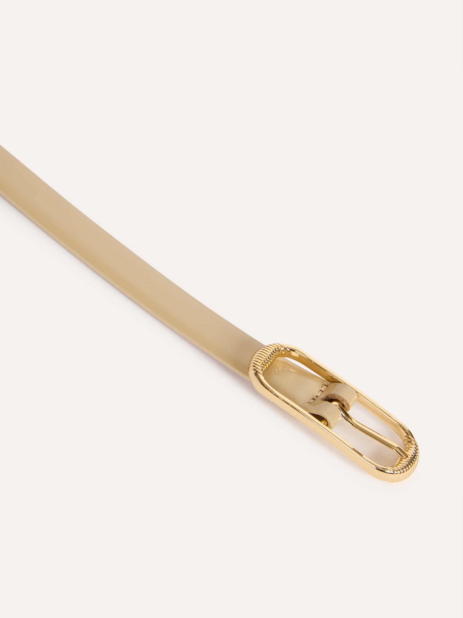 TENDRE champagne glazed leather thin belt, flat packshot by Rouje